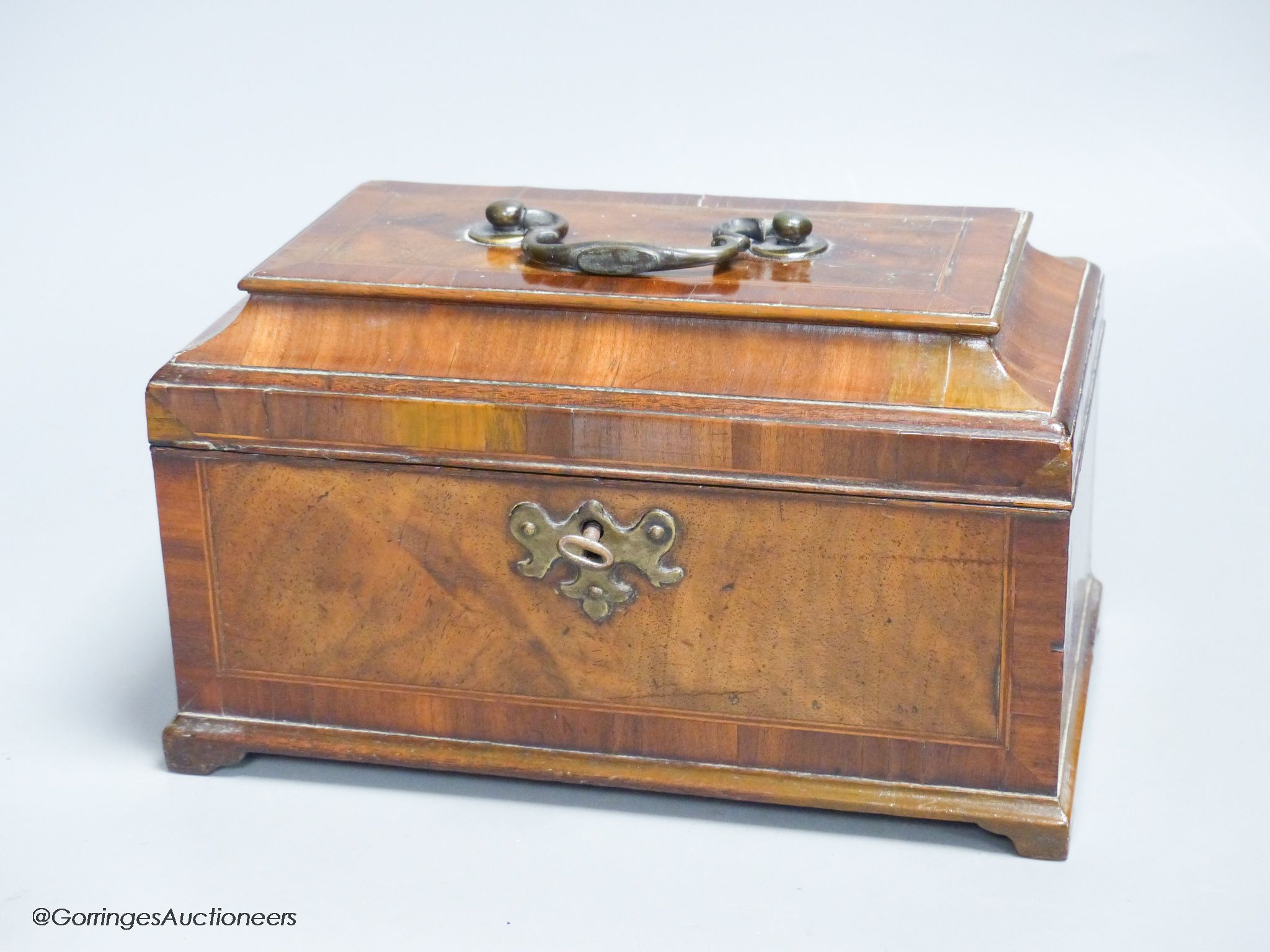 A late George II walnut line inlaid and cross banded tea caddy